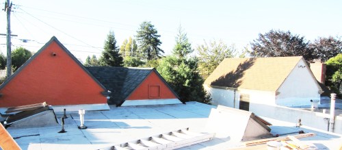 pointy-roofed existing house