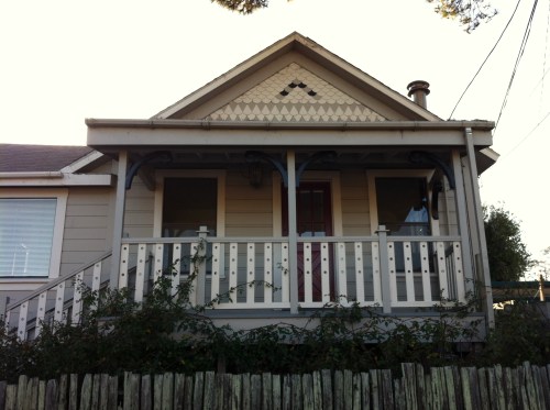 Painted railing with holes in the white pickets - nice black contrasting braces too