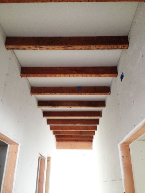 hallway ceiling with joists exposed
