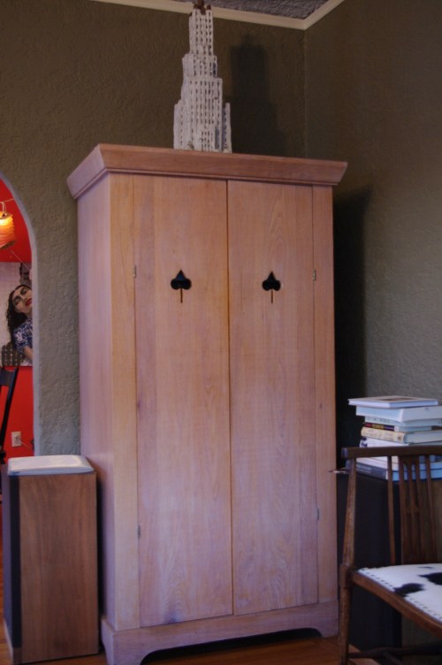 spade cutout pulls (Armoire by Dickson Schneider I believe)