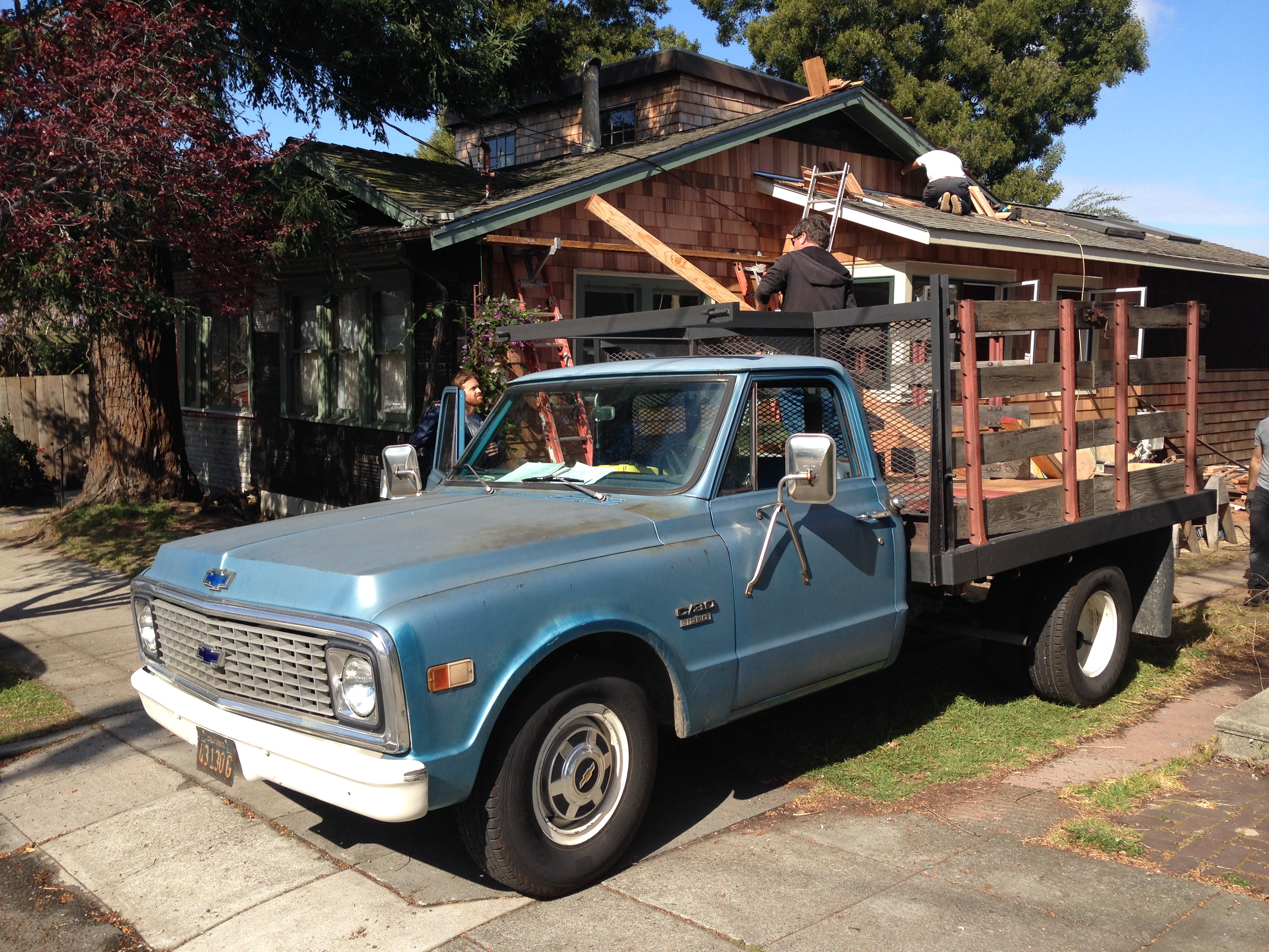 Blue Chevy and new red cedar shingles